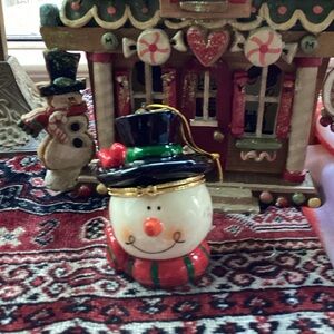 Cheerful Snowman Ornament with Black Hat and Red Scarf
